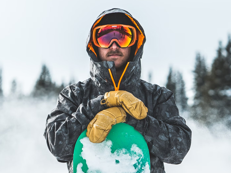 Man Holding Snowboard Snowboarding
